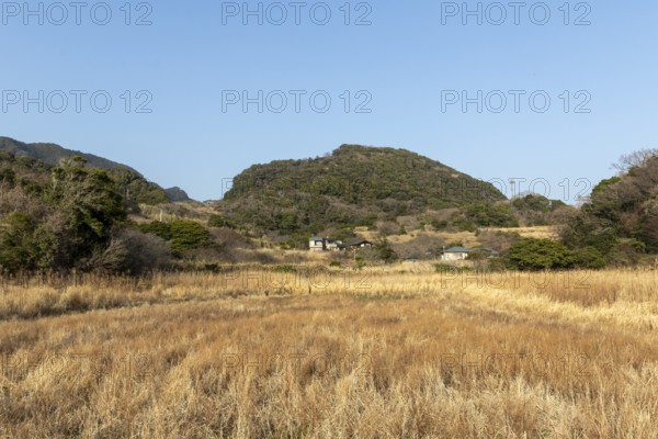 Residential houses in a rural mountain landscape in the evening light, Hota, Kyonan, Chiba Prefecture, Japan