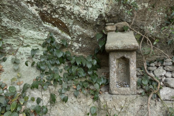 Small stone house for offerings with yen coins on the Shariki-michi Trail to Mount Nokogiri, Mount Nokogiri, Hamakanaya, Futtsu, Chiba Prefecture, Japan