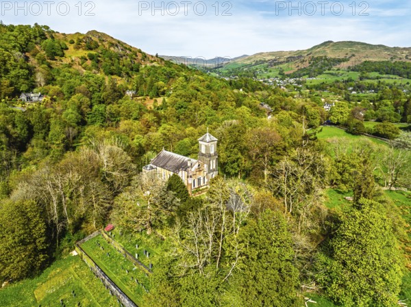 Holy Trinity Church from a drone, Bog Lane, Brathay village, Lake District, Cumbria, England, United Kingdom