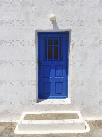 Blue door in white wall, Agios Nikolaos Mavrorachidi, chapel, Akrotiri, Santorini, Cyclades, Greece