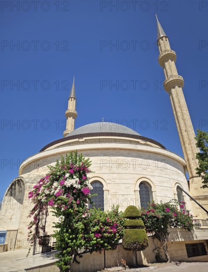 Kemer city centrum view of grand mosque Huzur Camii Dzamija with two minarets and dome. Beautiful religious architecture landmark in Turkey