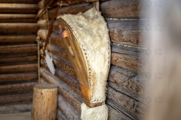 Interior design with fur on wooden walls in a cosy atmosphere, pile dwellings Unteruhldingen Open-Air Museum Lake Constance Germany