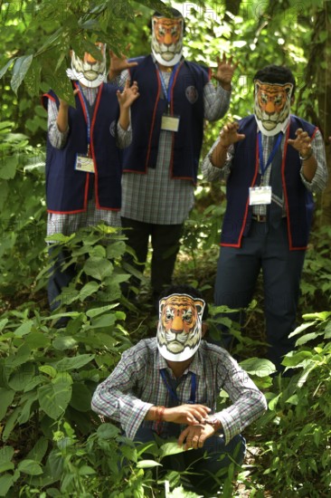 Agartala, Tripura, India, 29-07-2025: Students of NSS (National Service Scheme) unit from Mahatma Gandhi Memorial School wearing tiger masks during an event on Tiger Conservation on International Tiger day, organised by Sima Chakma, coordinator of MGM NSS UNIT at Agartala. International Tiger day is an annual celebration to raise awareness for tiger conservation, held annually on 29th July. Photo By-Abhisek Saha