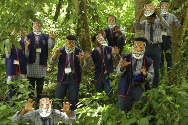 Agartala, Tripura, India, 29-07-2025: Students of NSS (National Service Scheme) unit from Mahatma Gandhi Memorial School wearing tiger masks during an event on Tiger Conservation on International Tiger day, organised by Sima Chakma, coordinator of MGM NSS UNIT at Agartala. International Tiger day is an annual celebration to raise awareness for tiger conservation, held annually on 29th July. Photo By-Abhisek Saha