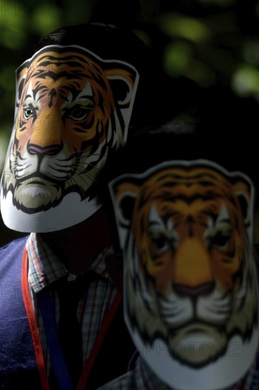 Agartala, Tripura, India, 29-07-2025: Students of NSS (National Service Scheme) unit from Mahatma Gandhi Memorial School wearing tiger masks during an event on Tiger Conservation on International Tiger day, organised by Sima Chakma, coordinator of MGM NSS UNIT at Agartala. International Tiger day is an annual celebration to raise awareness for tiger conservation, held annually on 29th July. Photo By-Abhisek Saha