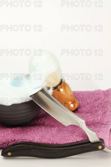 Shaving foam, brush and straight razor are ready for a perfect, classic shave