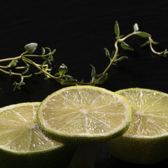 Three lime slices with green decoration