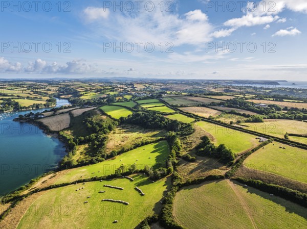 Farms and Fields over St Mawes from drone, Carrick Roads, River Fal, Falmouth, Cornwall, UK