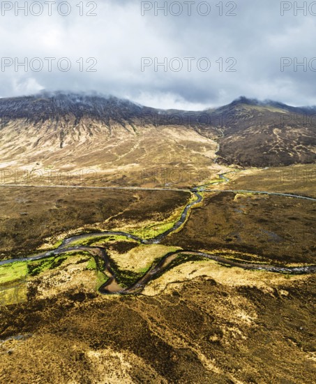 Panorama of Eas a' Bhradain Waterfall from drone, Red Cuillin mountains, Loch Ainort, Isle of Skye, Scotland, UK