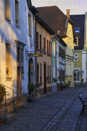 Colourful old town alley with traditional architecture in the evening light, Krefeld