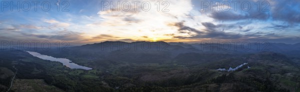 Panorama of Sunset over Mountains and Coniston Water from drone, Lake District National Park, Cumbria, England, United Kingdom