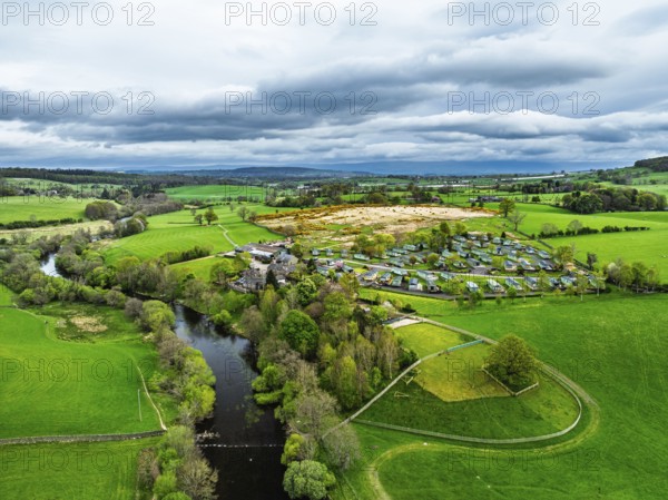 Farms over Ullswater Lake from drone, Pooley Bridge, Lake District National Park, Cumbria, England, United Kingdom