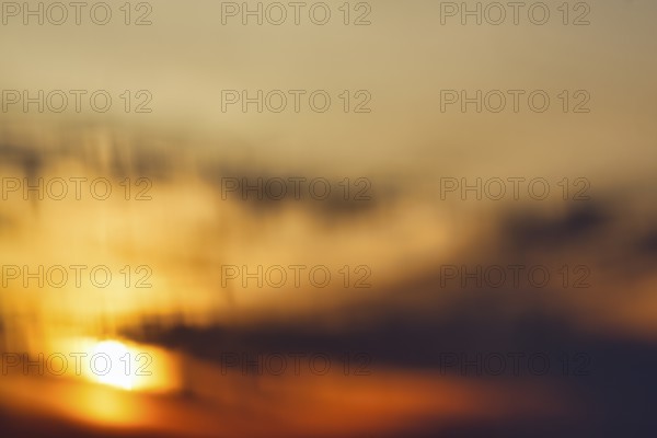Sunset behind clouds, wipe effect, full-frame, Oia, Thira, Santorini, Cyclades, Greece