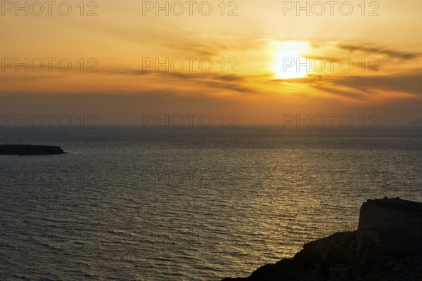 Evening sun behind Cirrus, sunset by the sea, Oia, Thira, Santorini, Cyclades, Greece