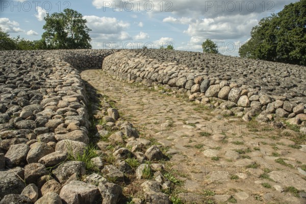 Entrance to King's grave, a 75-meter-diameter Bronze Age cairn containing a coffin with ten stone slabs with carved figures, in Kivik, Simrishamn Municipality, SkÃ¥ne County, Sweden, Scandinavia