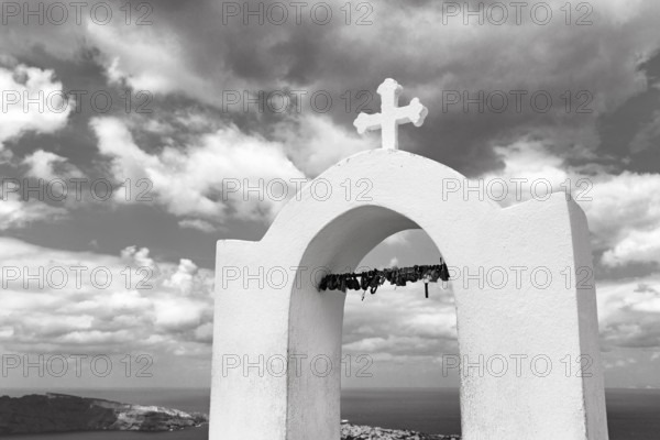 Love locks on the bell tower of an orthodox church, monochrome, hiking trail from Fira to Oia, Thira, Santorini, Cyclades, Greece