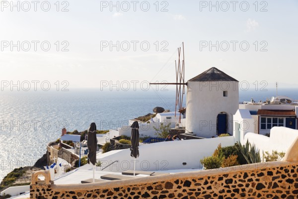 Traditional windmill, holiday homes with sea view, Oia, Thira, Santorini, Cyclades, Greece