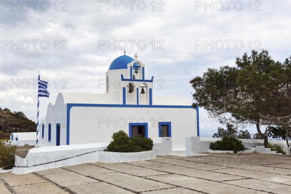 Orthodox chapel Mikros Profitis Ilias with blue dome, hiking trail from Fira to Oia, Thira, Santorini, Cyclades, Greece