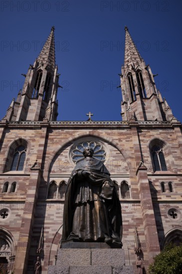 Monument, statue of Charles Emile Freppel, theologian and Bishop of Angers, in front of the church Ã‰glise Saints Pierre et Paul, St. Peter et St. Paul, old town, Obernai, also Oberehnheim, Bas-Rhin, Grand-Est, Alsace, France