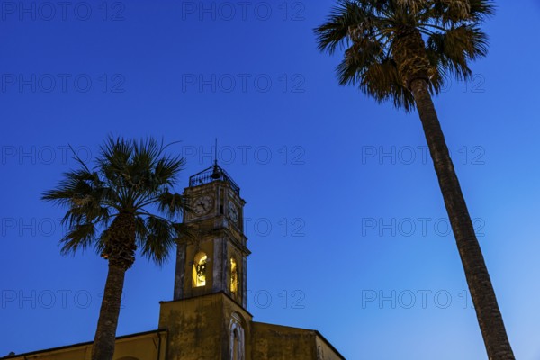 Illuminated steeple of the Madonna del Carmine church, night shot, Porto Azzurro, Elba Island, Tuscan Archipelago National Park, Tuscany, Italy