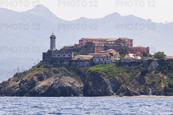Fortress Forte Stella with lighthouse, behind the mountains Monte Serra and Monte Strega, Portoferraio, Elba Island, Tuscan Archipelago National Park, Tuscany, Italy