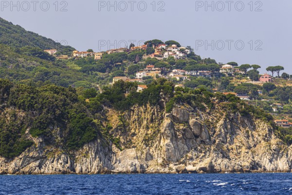 The village of Sant' Andrea above a rocky cliff, Elba Island, Tuscan Archipelago National Park, Tuscany, Italy