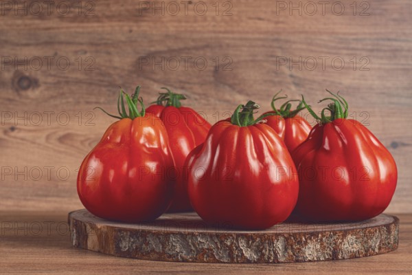 Khinkali tomatoes, on a wooden cutting board, wooden background, no people