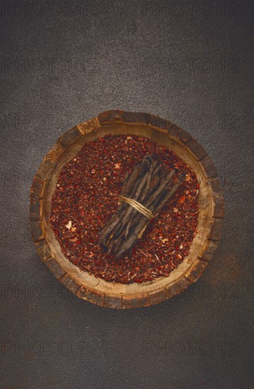 Madder dye, Endro, rhizome for coloring eggs, powder from the roots of endro with onion husks, in a wooden plate, top view, Easter, Georgia