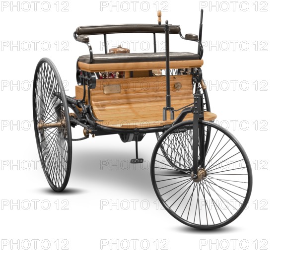 Replica of a old historic vehicle named patent motorcar isolated in white back with shadow