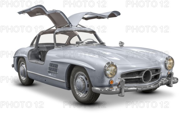 Historic car with opened wing doors isolated in white back with shadow
