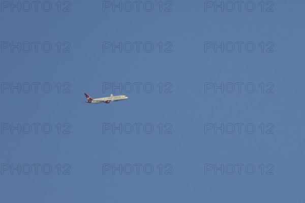 Boeing 787-9 Dreamliner jet passenger aircraft of Virgin Atlantic airlines in flight in a blue sky, England, United Kingdom