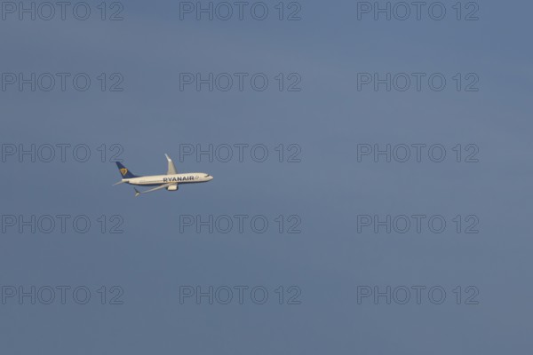 Boeing 737 jet passenger aircraft of Ryanair airlines in flight in a blue sky, Rome, Italy