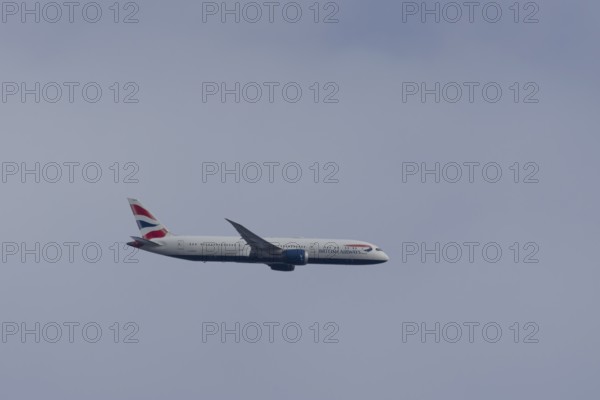 Boeing 787-9 Dreamliner jet passenger aircraft of British Airways airlines in flight in a blue sky, London, England, United Kingdom