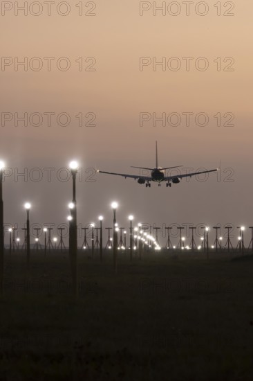 Boeing 737 jet aircraft of Ryanair airlines in flight landing at sunset at London Stansted airport, Essex, England, United Kingdom