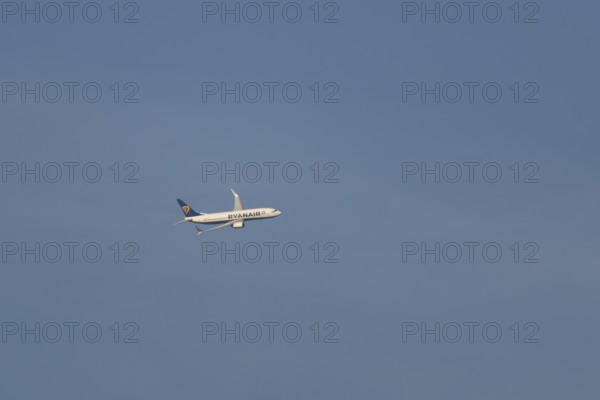 Boeing 737 jet passenger aircraft of Ryanair airlines in flight in a blue sky, Rome, Italy