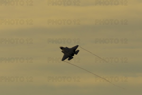 Lockheed Martin F-35 Lightning II fighter military aircraft of the United States air force USAF taking off in flight at RAF Lakenheath airbase, Suffolk, England, United Kingdom