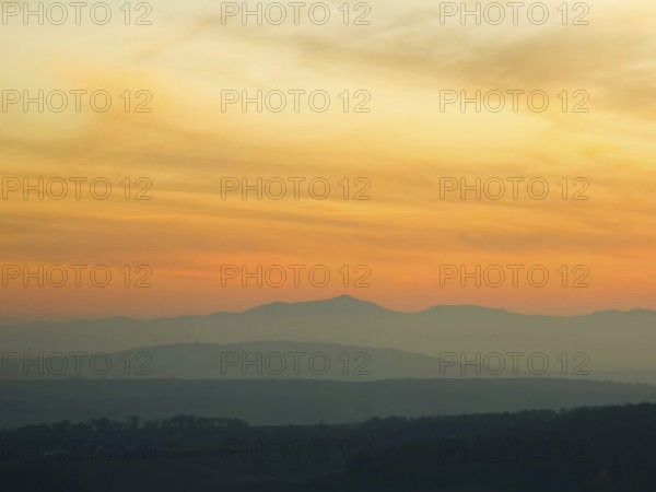Silhouettes of mountains in the soft light of a pastel-coloured sunset Leiserbergen Weinviertel Lower Austria Austria