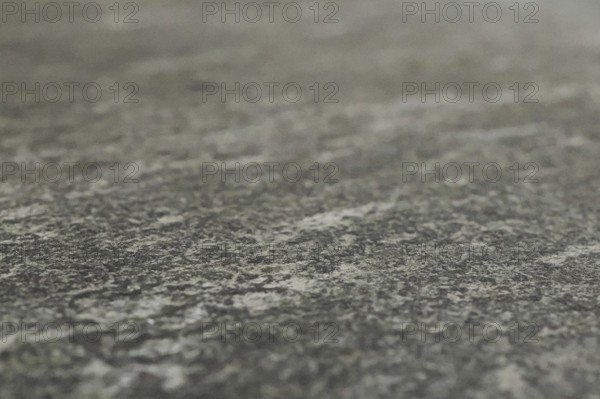 Grey granite surface as background, blurred background, North Rhine-Westphalia, Germany