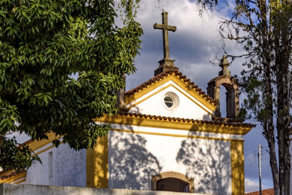 Facade of a church from the early 18th century among the vegetation in the city of Ouro Preto