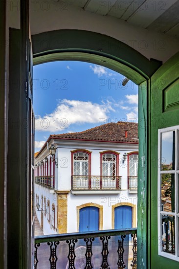 Windows, doors and the colonial architecture of the city of Ouro Preto through an old window, Ouro Preto, Minas Gerais, Brazil