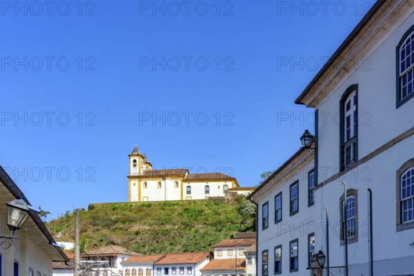 Baroque church on top of the hill among the colonial houses of the city of Ouro Preto, Ouro Preto, Minas Gerais, Brazil
