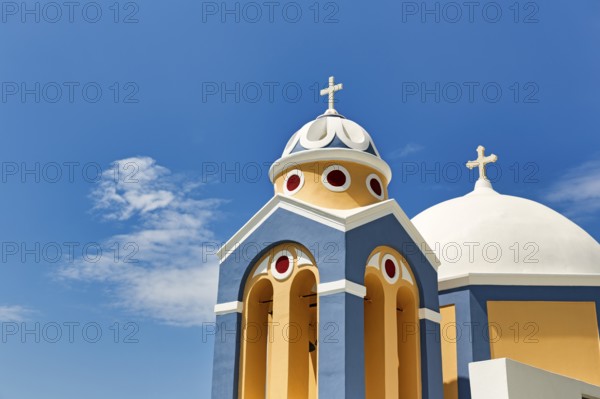 Catholic Church of Saint Stylianos, colourful facade, domes, Fira, Thira, Santorini, Cyclades, Greece
