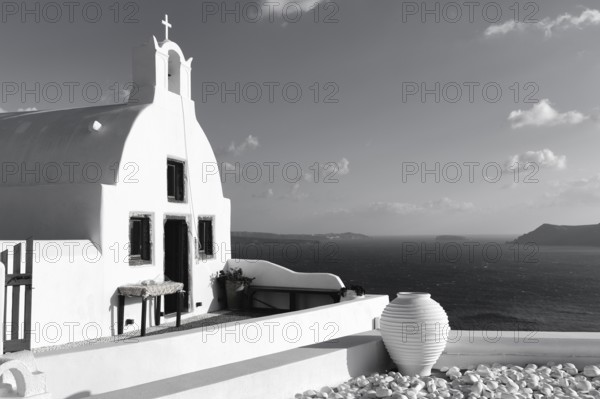 White architecture, orthodox church by the sea, monochrome, Oia, Santorini, Cyclades, Aegean Sea, Greece