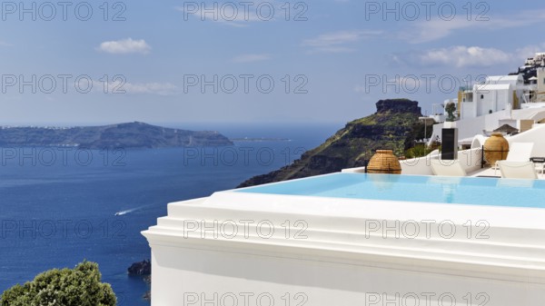 Infinity pool with views of the caldera and the sea, Skaros rock formation, Firostefani, Thira, Santorini, Cyclades, Greece