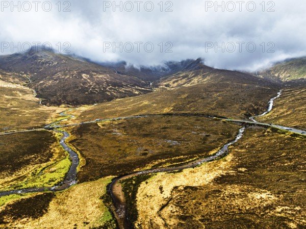 Eas a' Bhradain Waterfall from drone, Red Cuillin mountains, Loch Ainort, Isle of Skye, Scotland, UK