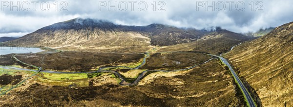 Panorama of Eas a' Bhradain Waterfall from drone, Red Cuillin mountains, Loch Ainort, Isle of Skye, Scotland, UK