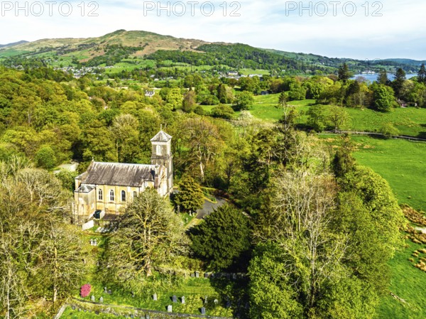 Holy Trinity Church from a drone, Bog Lane, Brathay village, Lake District, Cumbria, England, United Kingdom