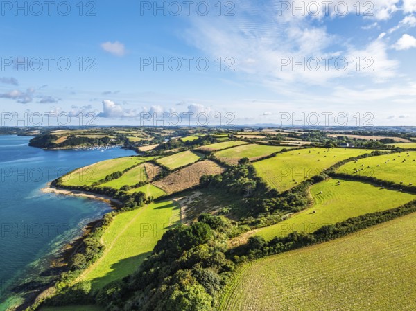 Farms and Fields over St Mawes from drone, Carrick Roads, River Fal, Falmouth, Cornwall, UK