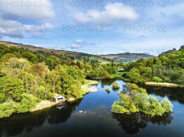 Farms and Mountains over road A591 from a drone, Grasmere Lake, Grasmere, Ambleside, Lake District, Westmorland, Cumbria, UK