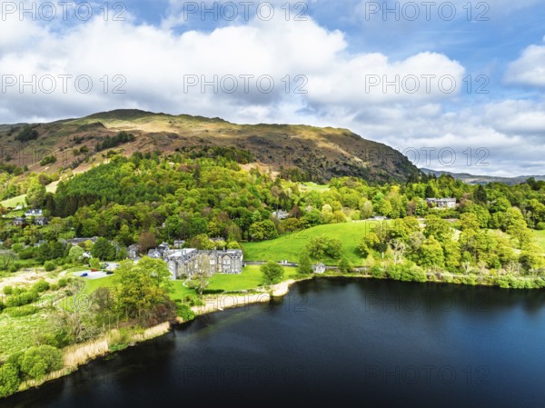 Farms and Mountains over road A591 from a drone, Grasmere Lake, Grasmere, Ambleside, Lake District, Westmorland, Cumbria, UK